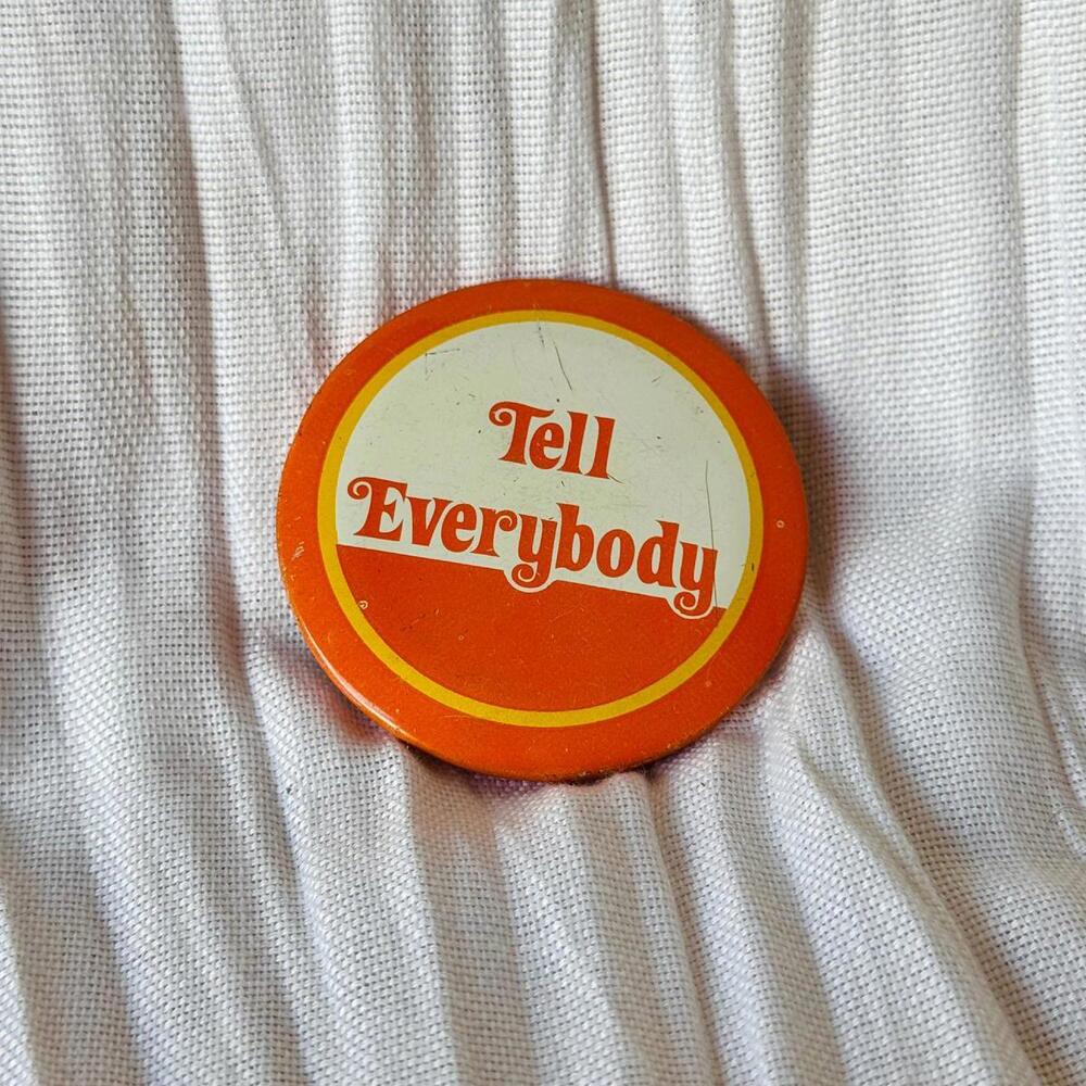 Vintage Orange ‘Tell Everybody’ Hippie Pin
